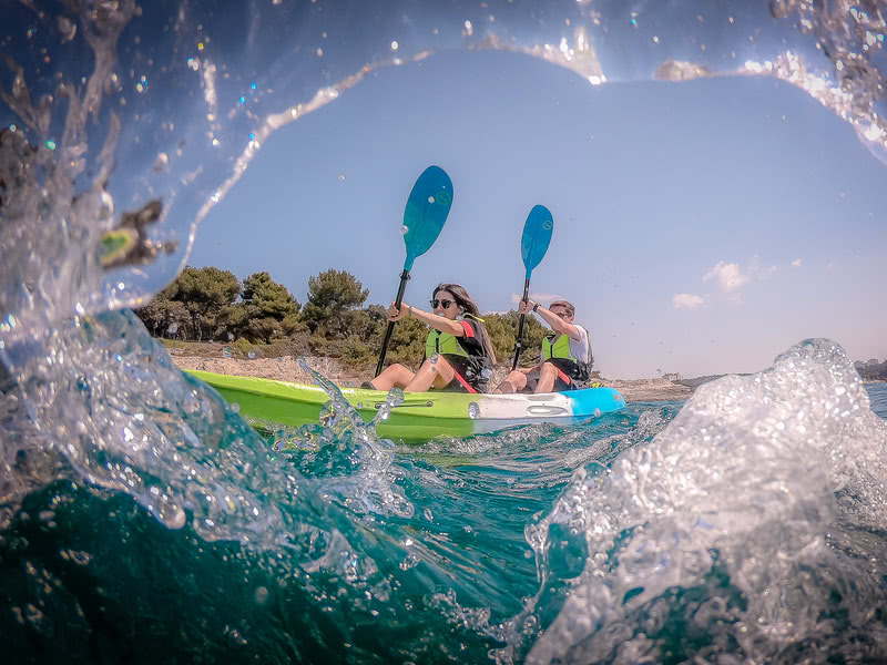 Kayakers enjoying a scenic paddle along the picturesque seaside of Pula